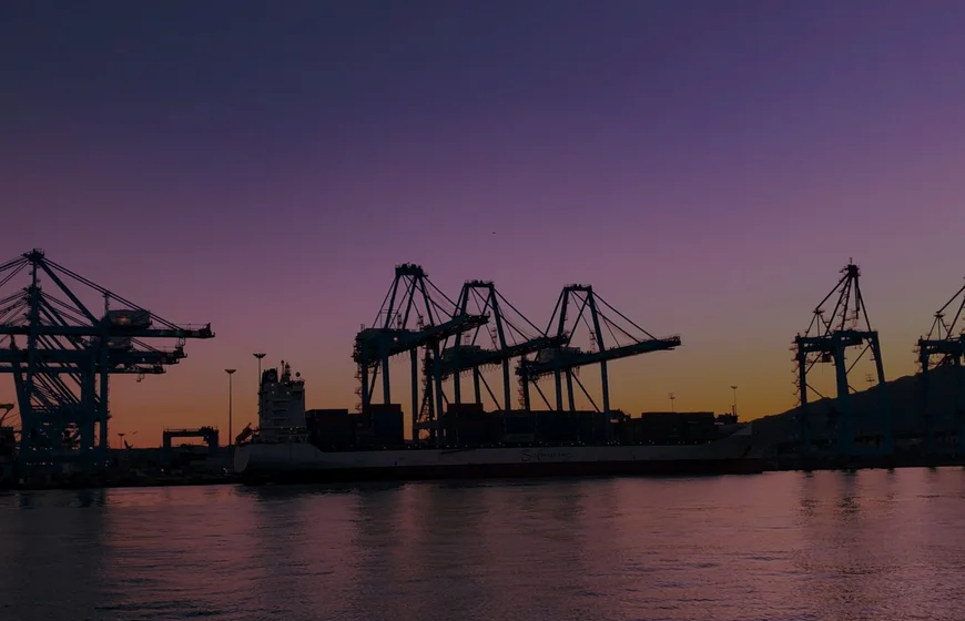 Container port at sunset symbolizing global shipping contract negotiations
