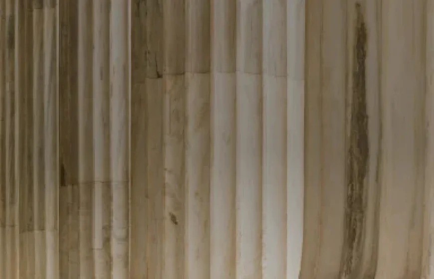 Stone columns symbolizing international arbitration and legal stability in trade and marine insurance