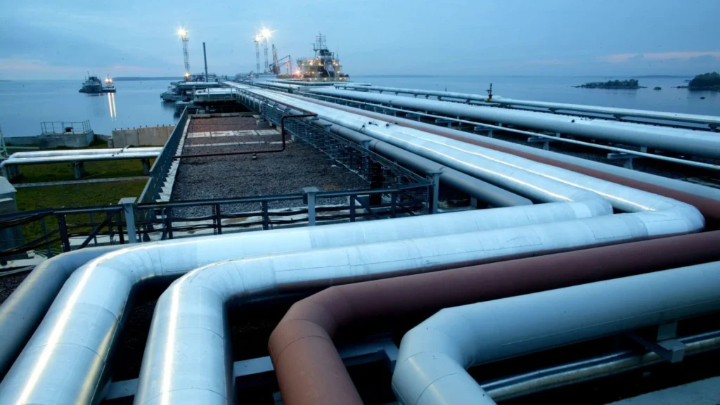 Pipelines and an oil tanker at a marine terminal for liquid bulk cargo transportation.